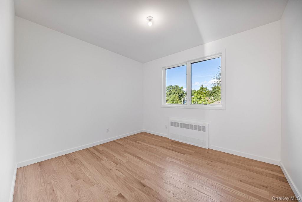 40 Singer Avenue, Unit 201 Spring Valley, NY 10977 - Photo 29 of 50 an empty room with windows