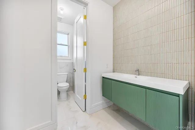 a bathroom with a sink and a toilet