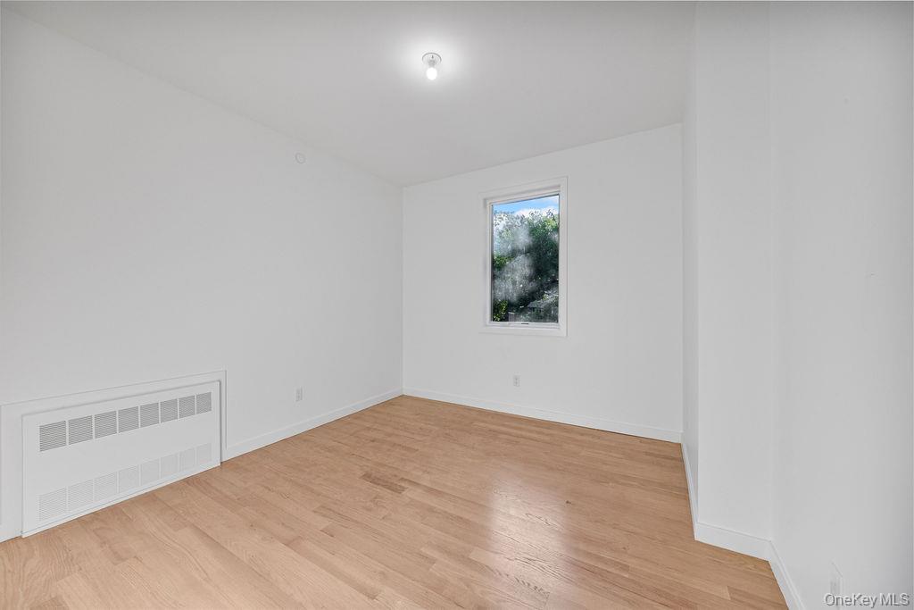 40 Singer Avenue, Unit 201 Spring Valley, NY 10977 - Photo 33 of 50 an empty room with a window