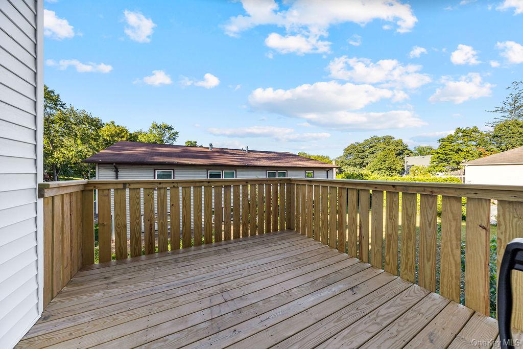 40 Singer Avenue, Unit 201 Spring Valley, NY 10977 - Photo 38 of 50 a view of deck with wooden floor and fence with wooden fence