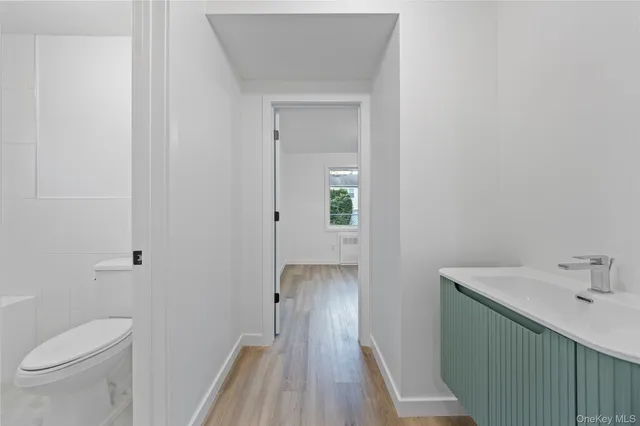 a bathroom with a sink and toilet