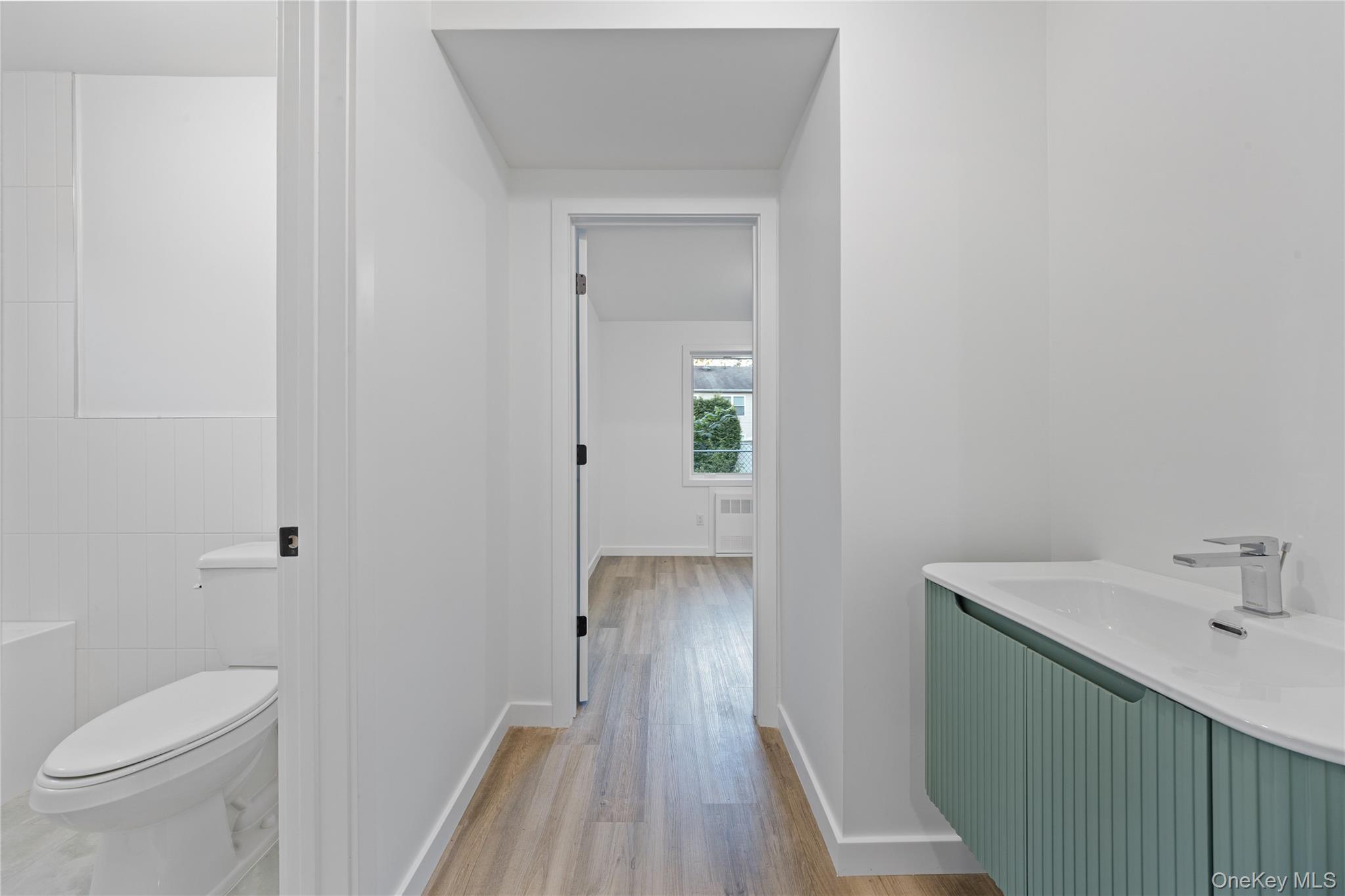 40 Singer Avenue, Unit 201 Spring Valley, NY 10977 - Photo 50 of 50 a bathroom with a sink and toilet