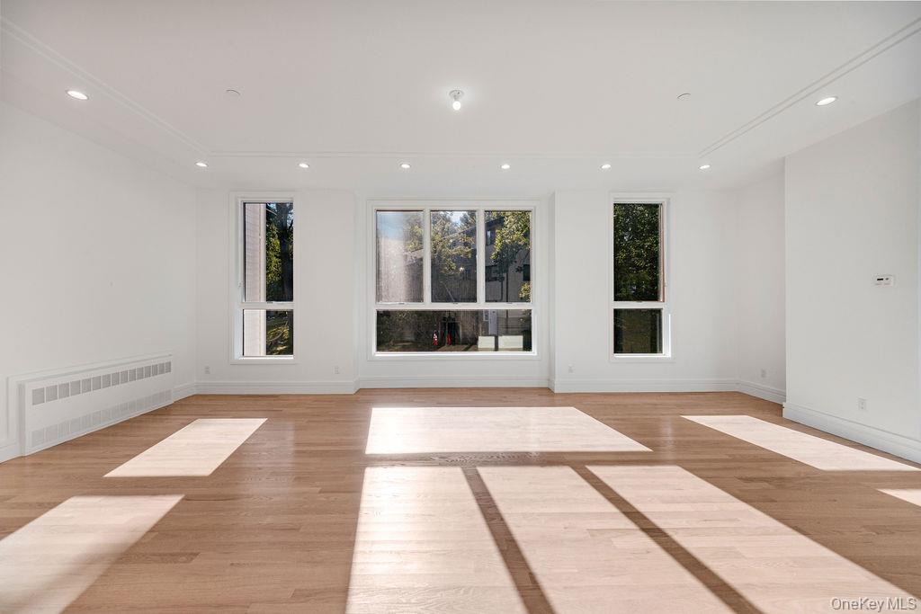 40 Singer Avenue, Unit 201 Spring Valley, NY 10977 - Photo 7 of 50 a view of an empty room with windows