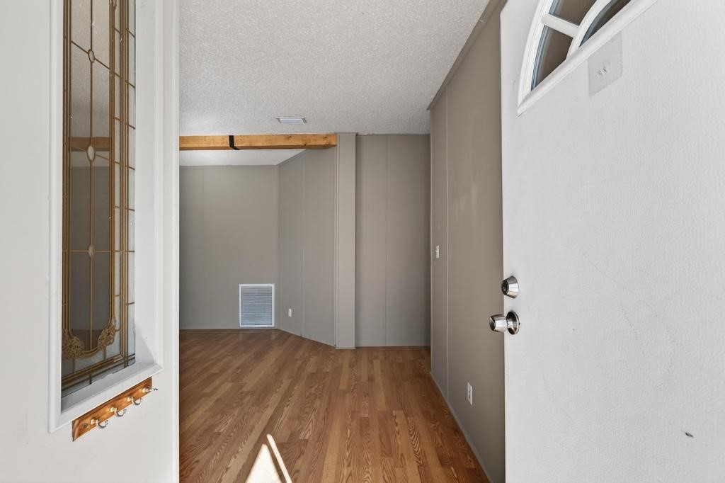 2744 Roy Sikes Road Hilliard, FL 32046 - Photo 10 of 97 a view of walk in closet with wooden floor