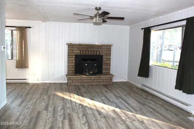 an empty room with wooden walls