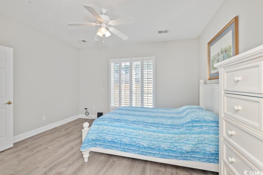 110 Cart Crossing Drive, Unit 102 Conway, SC 29526 - Photo 19 of 39 Bedroom with light wood-style flooring and a ceiling fan