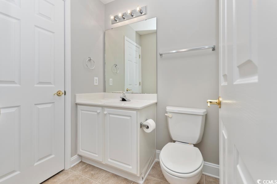 110 Cart Crossing Drive, Unit 102 Conway, SC 29526 - Photo 34 of 39 Half bath with vanity and light tile patterned flooring