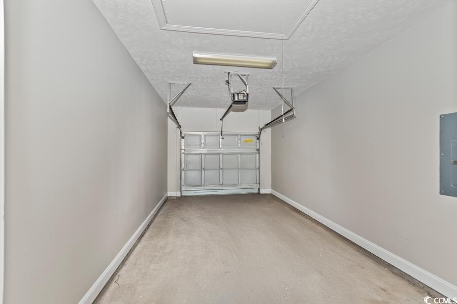 110 Cart Crossing Drive, Unit 102 Conway, SC 29526 - Photo 38 of 39 Garage featuring electric panel and a garage door opener