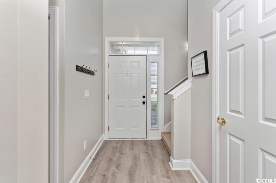 110 Cart Crossing Drive, Unit 102 Conway, SC 29526 - Photo 5 of 39 Entrance foyer featuring light wood-style floors and stairs