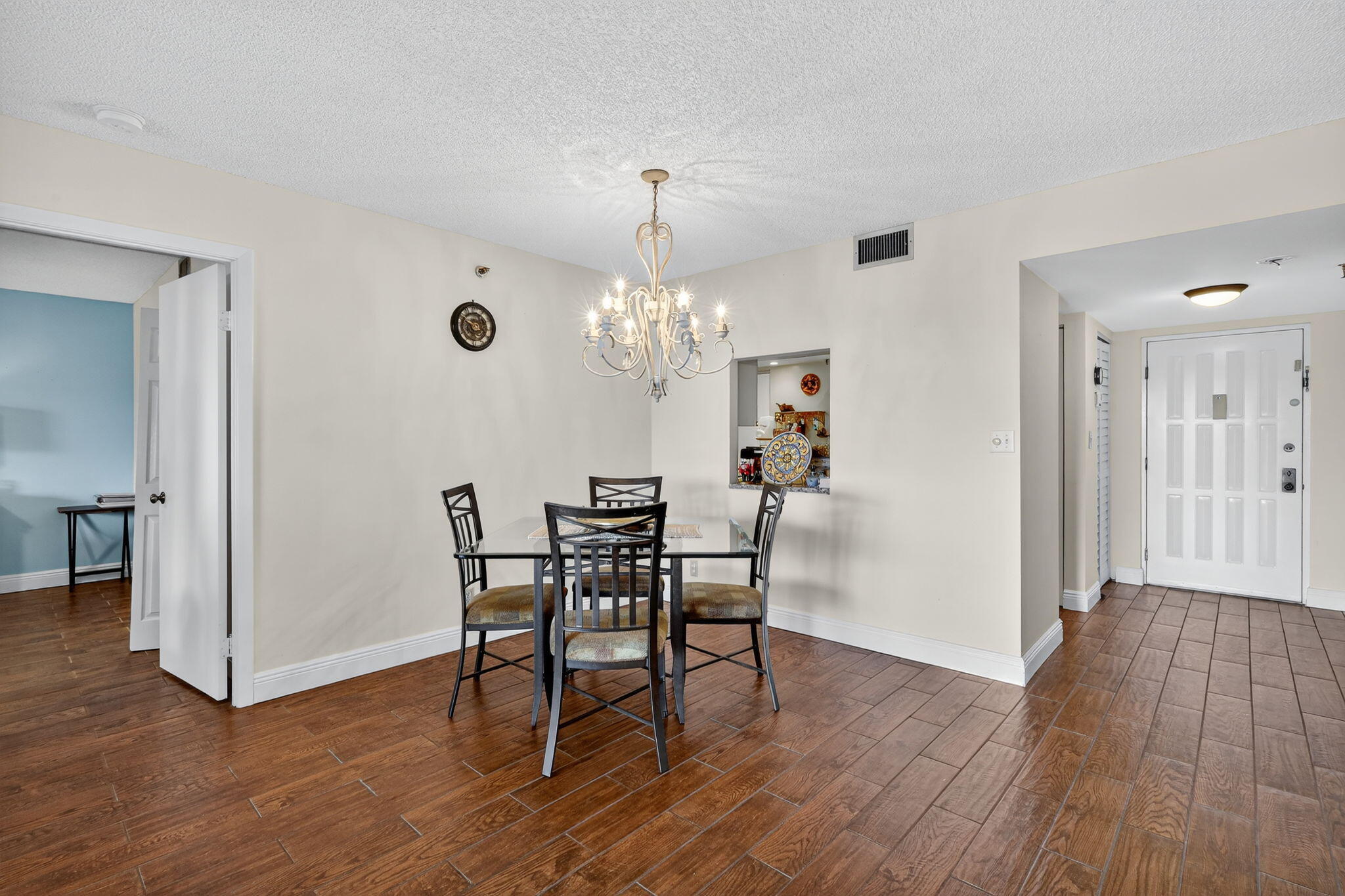 5340 Northwest 2nd Avenue, Unit 421 Boca Raton, FL 33487 - Photo 21 of 54 a view of a dining room with furniture and wooden floor