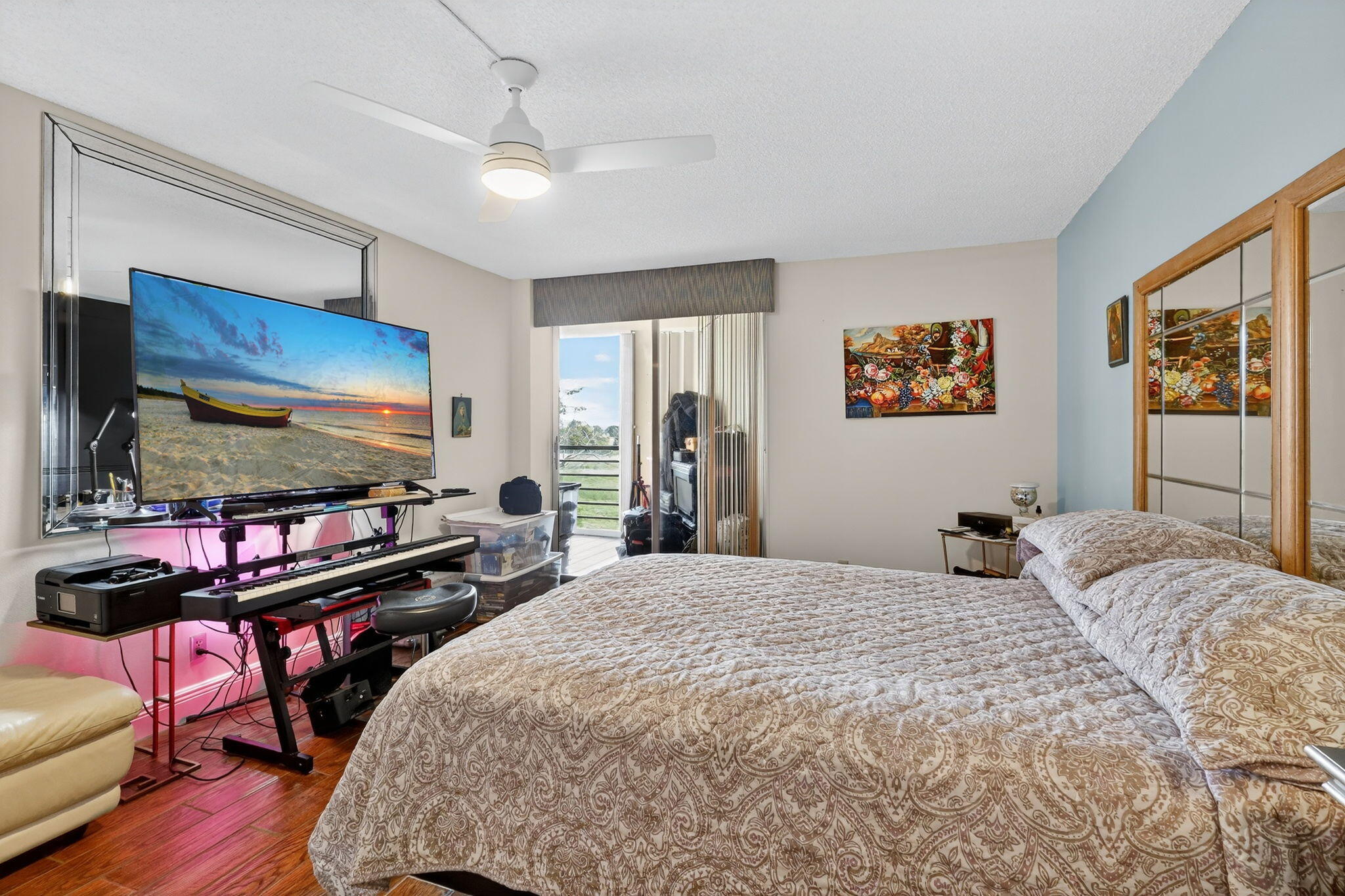 5340 Northwest 2nd Avenue, Unit 421 Boca Raton, FL 33487 - Photo 24 of 54 a bedroom with a bed and a flat screen tv