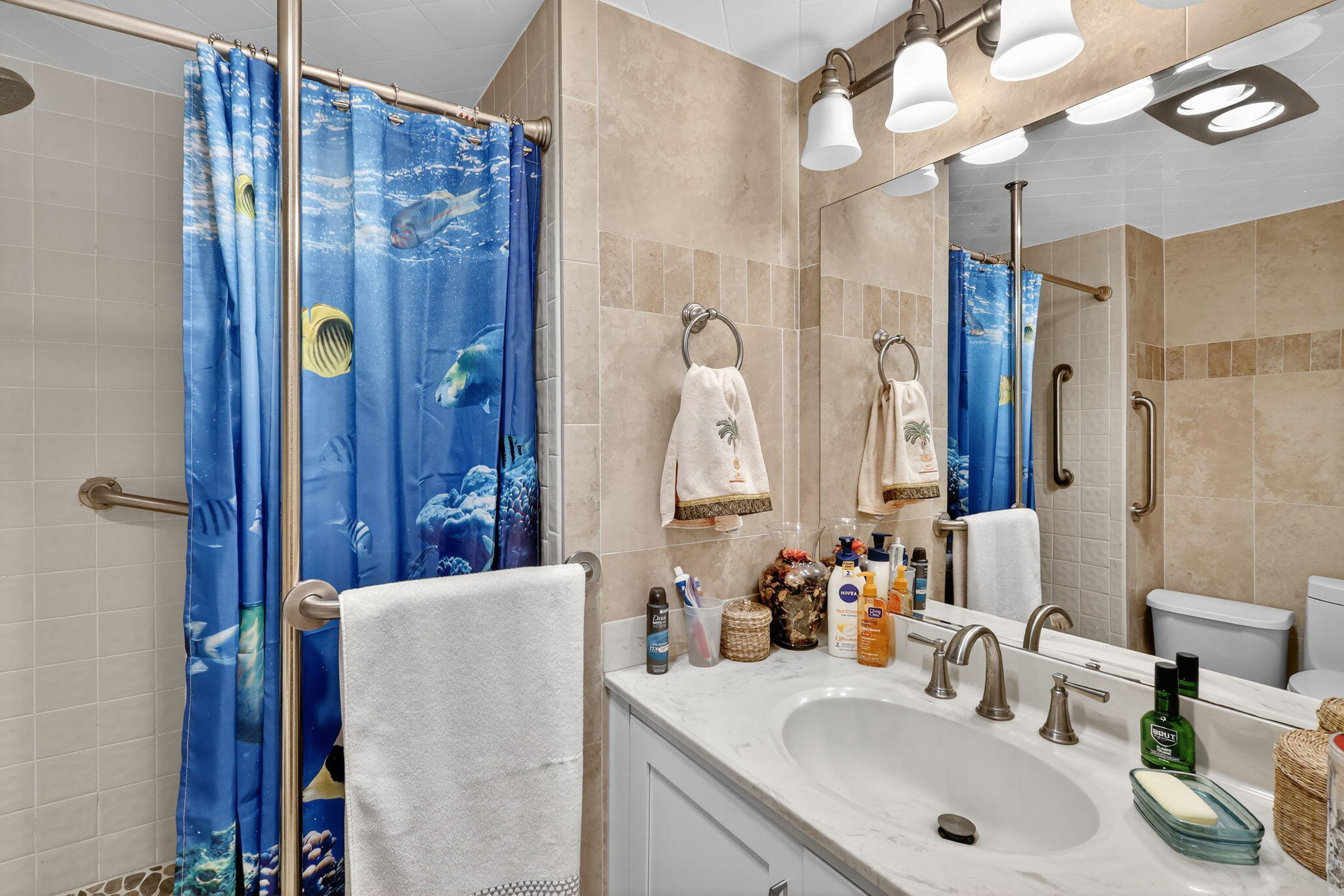 5340 Northwest 2nd Avenue, Unit 421 Boca Raton, FL 33487 - Photo 33 of 54 a bathroom with a sink and a mirror