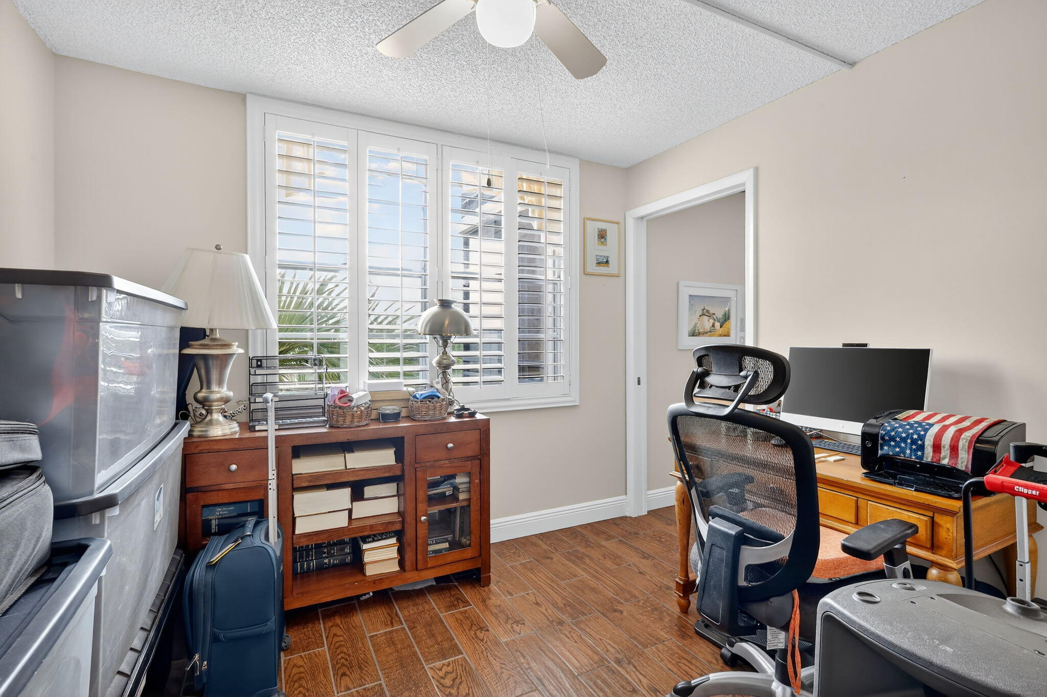 5340 Northwest 2nd Avenue, Unit 421 Boca Raton, FL 33487 - Photo 35 of 54 a view of a workspace with furniture and a window