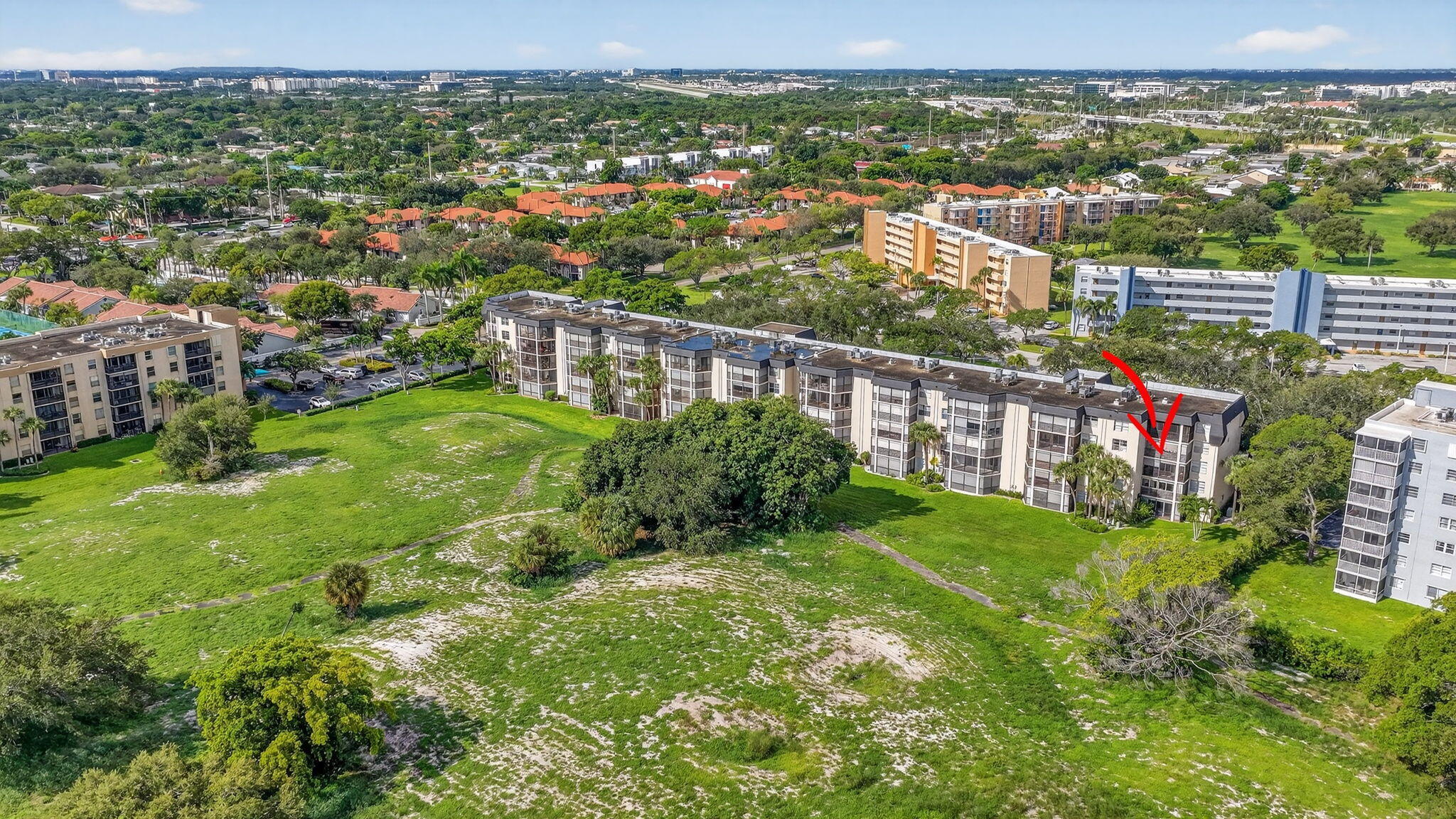 5340 Northwest 2nd Avenue, Unit 421 Boca Raton, FL 33487 - Photo 44 of 54 an aerial view of residential houses with outdoor space and trees