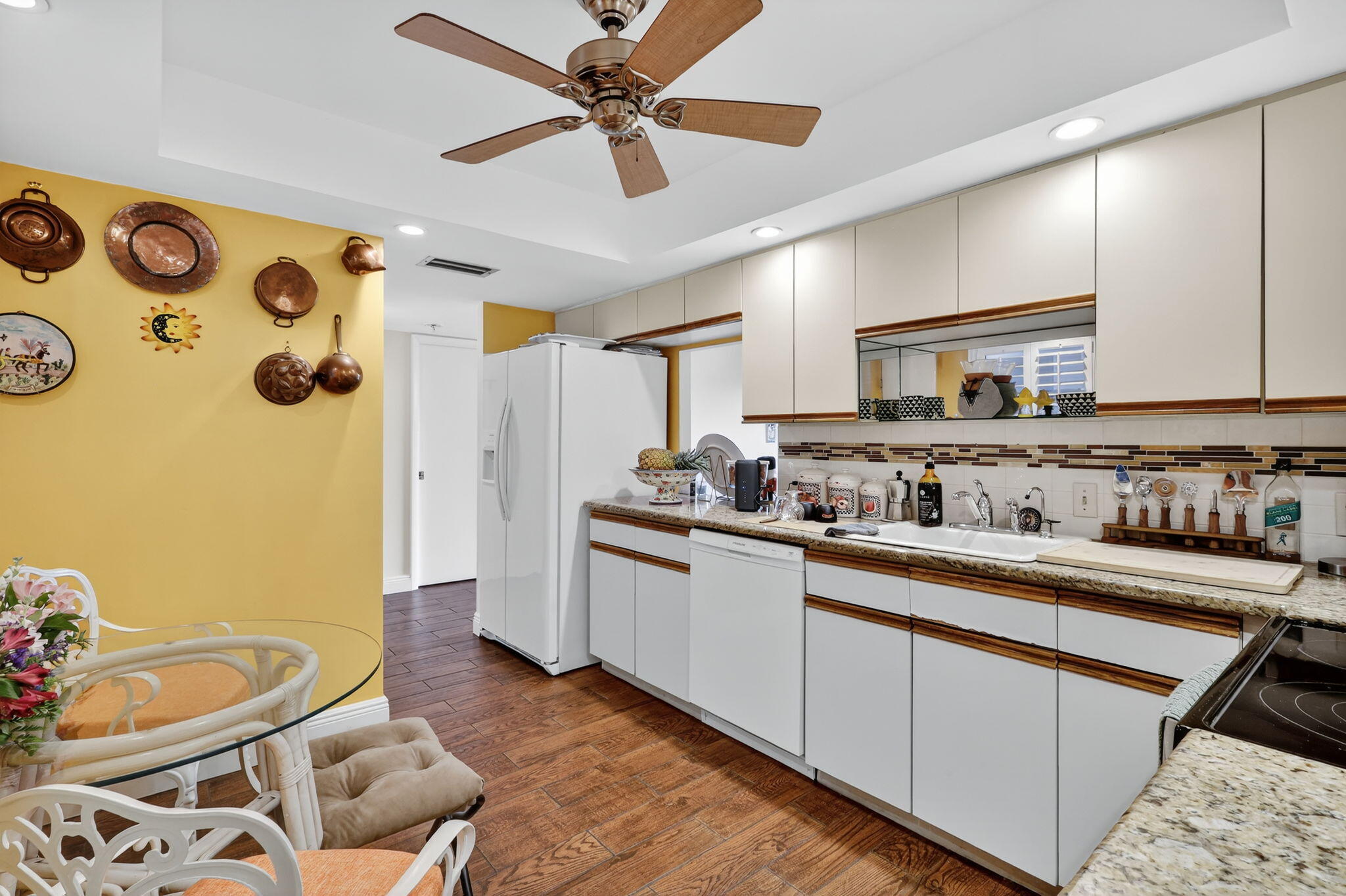 5340 Northwest 2nd Avenue, Unit 421 Boca Raton, FL 33487 - Photo 5 of 54 a kitchen with stainless steel appliances granite countertop a sink and cabinets