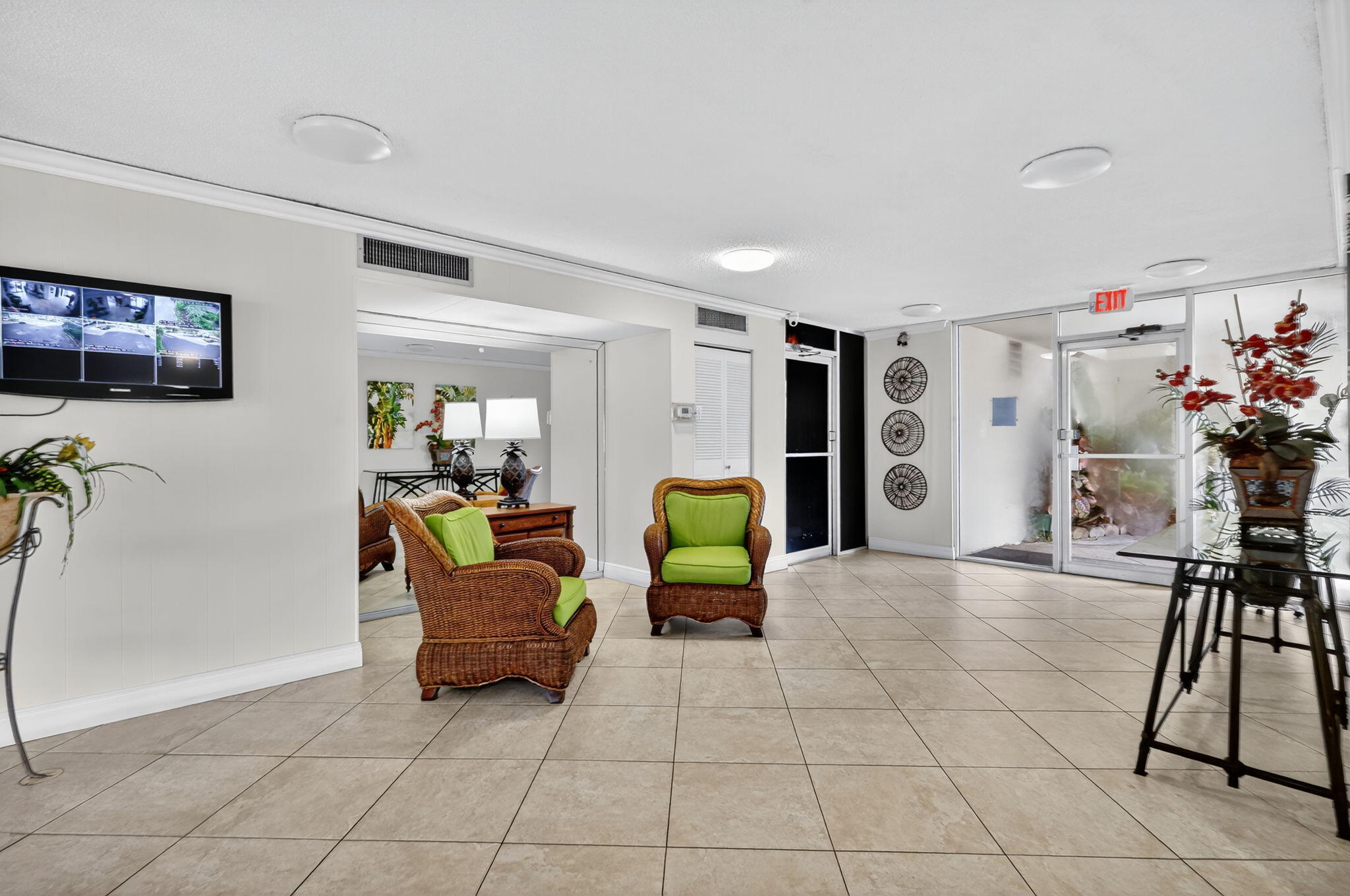 5340 Northwest 2nd Avenue, Unit 421 Boca Raton, FL 33487 - Photo 51 of 54 a living room with furniture and a flat screen tv