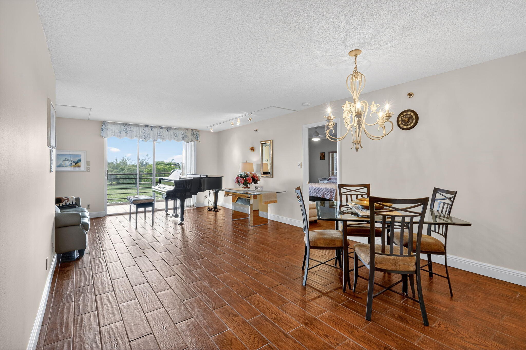 5340 Northwest 2nd Avenue, Unit 421 Boca Raton, FL 33487 - Photo 9 of 54 a view of a dining room with furniture and wooden floor