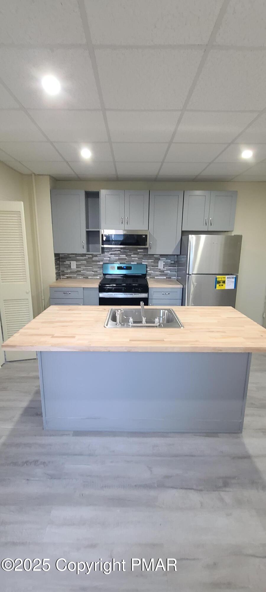 722 Monroe Street Stroudsburg, PA 18360 - Photo 11 of 11 a view of kitchen with stainless steel appliances wooden floor