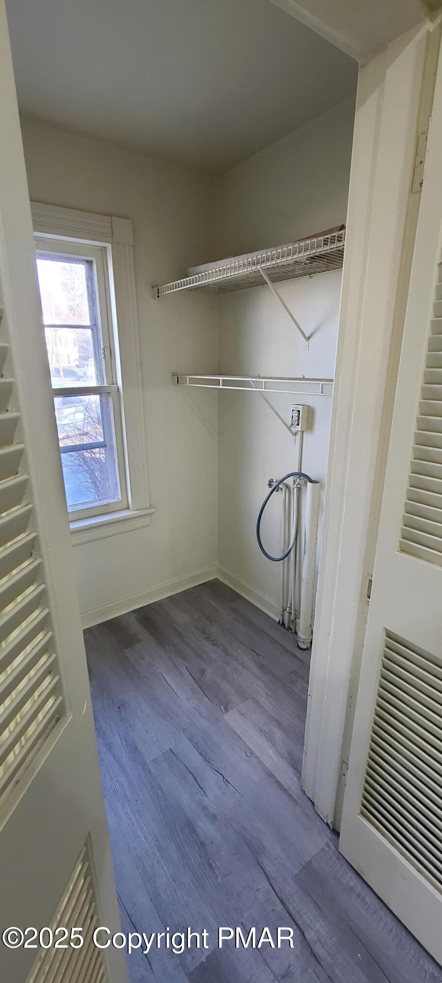 722 Monroe Street Stroudsburg, PA 18360 - Photo 10 of 11 a view of an empty room with wooden floor and windows