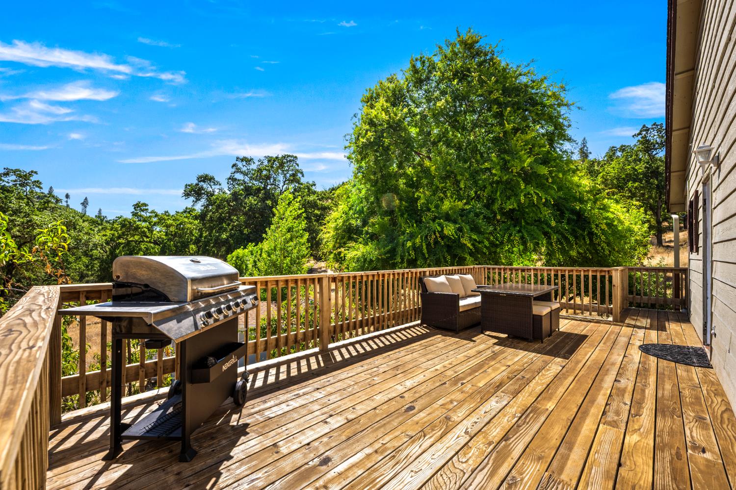 2162 Painted Pony Road Somerset, CA 95684 - Photo 29 of 65 a view of balcony with wooden floor and outdoor seating
