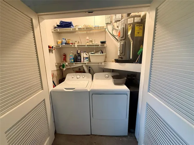 a utility room with dryer and washer