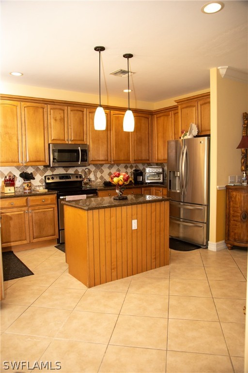 4345 Mistlethrush Lane Naples, FL 34119 - Photo 15 of 29 a kitchen with stainless steel appliances granite countertop a stove a sink dishwasher and a refrigerator