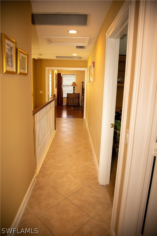 4345 Mistlethrush Lane Naples, FL 34119 - Photo 17 of 29 a view of a hallway with wooden floor and staircase
