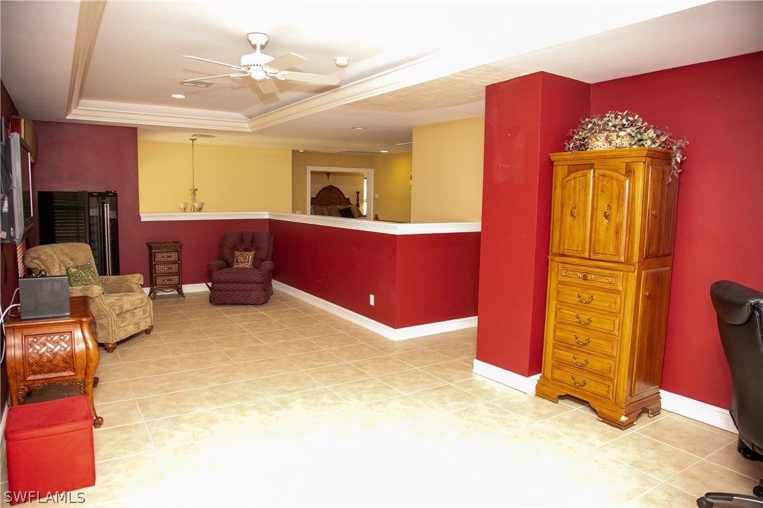 4345 Mistlethrush Lane Naples, FL 34119 - Photo 18 of 29 a kitchen with sink refrigerator and window