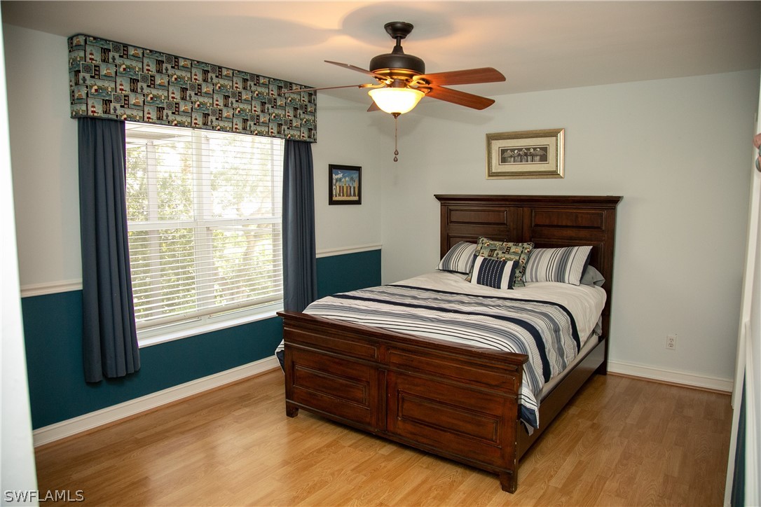 4345 Mistlethrush Lane Naples, FL 34119 - Photo 21 of 29 a bedroom with a bed and a window