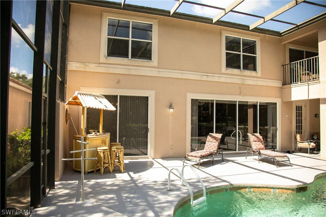 4345 Mistlethrush Lane Naples, FL 34119 - Photo 5 of 29 a view of house with outdoor space and porch