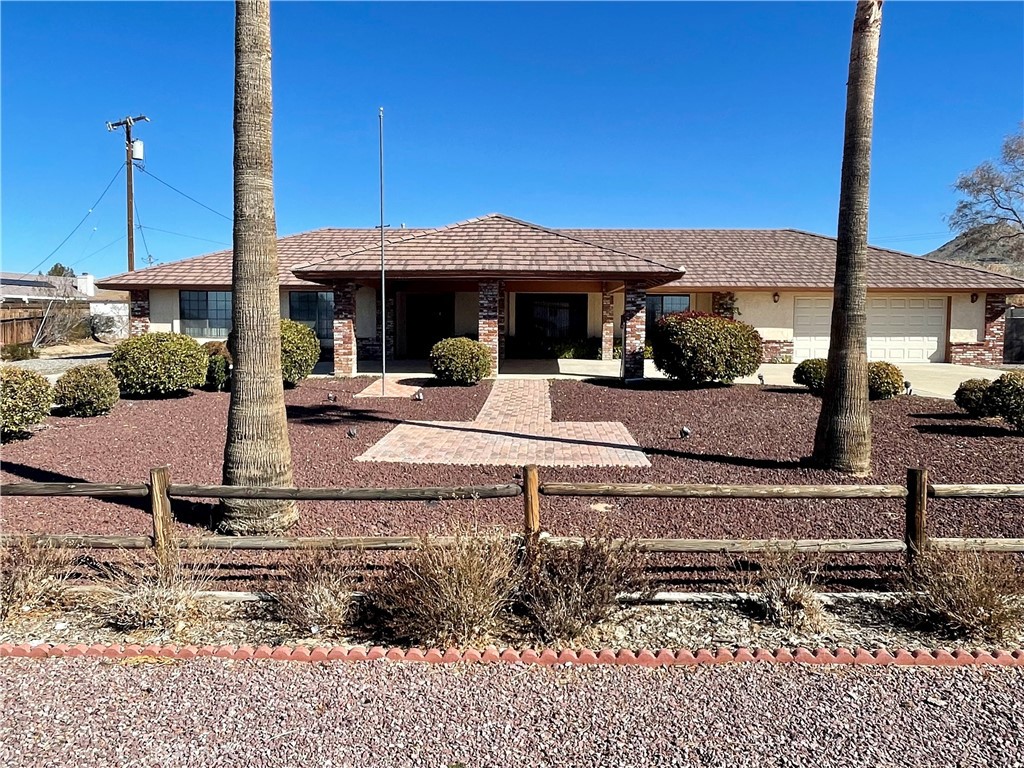 16111 Wintun Road Apple Valley, CA 92307 - Photo 1 of 1 a front view of a house with garden