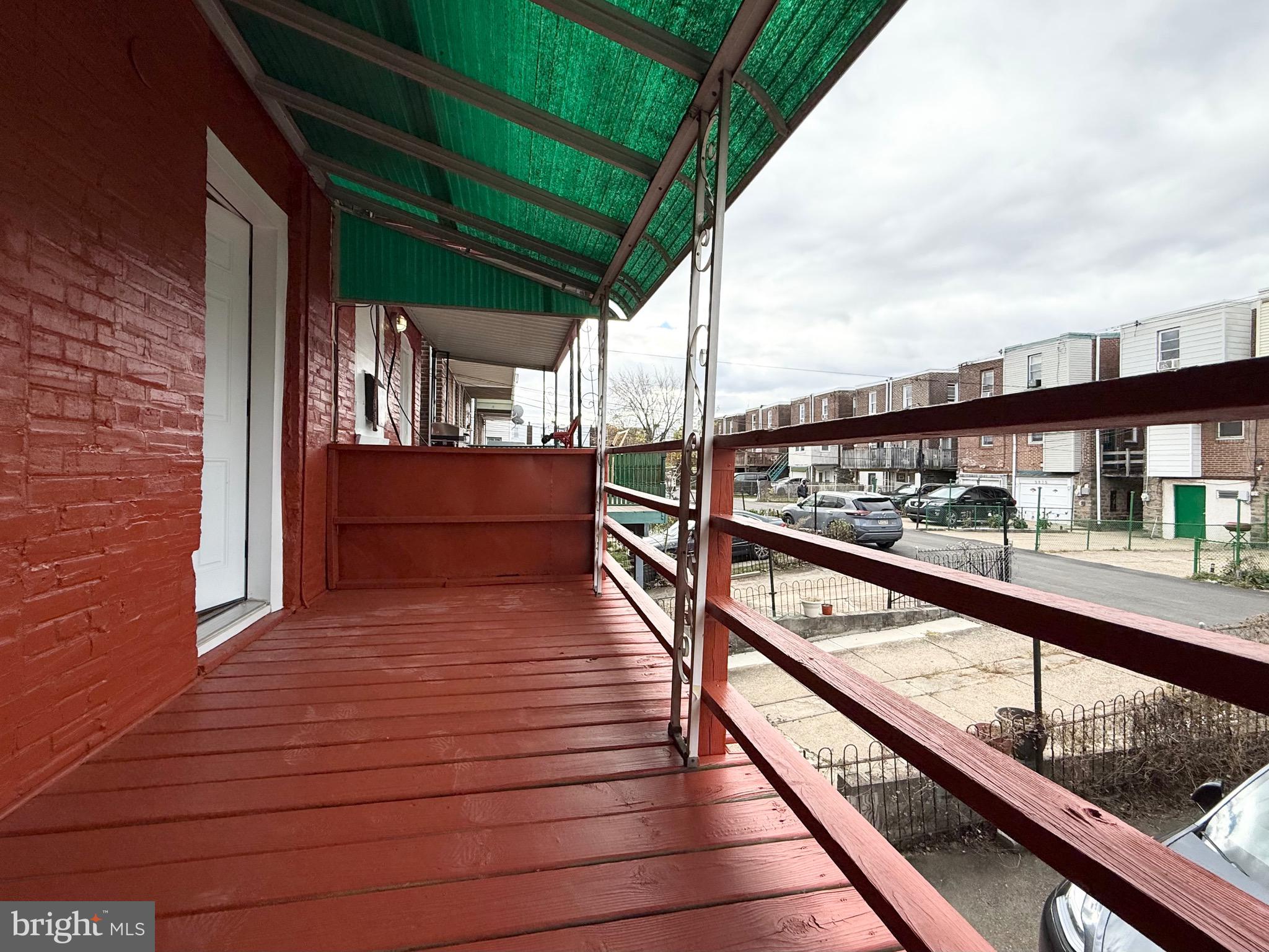 5842 North Hope Street Philadelphia, PA 19120 - Photo 18 of 45 a view of balcony with wooden floor and outdoor seating