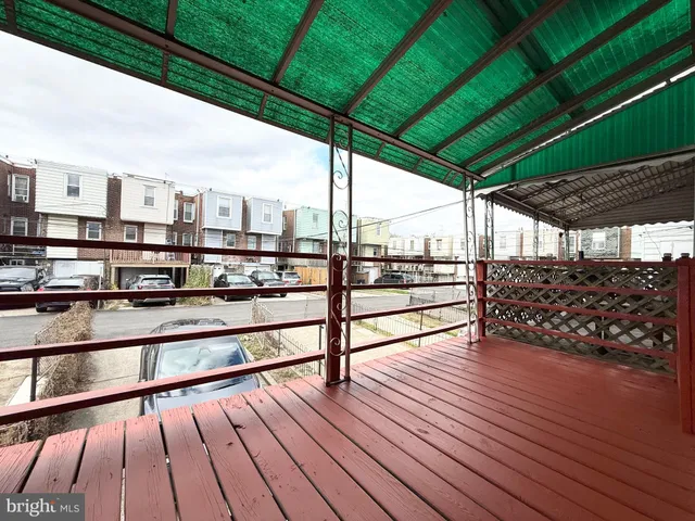 a view of porch with wooden floor