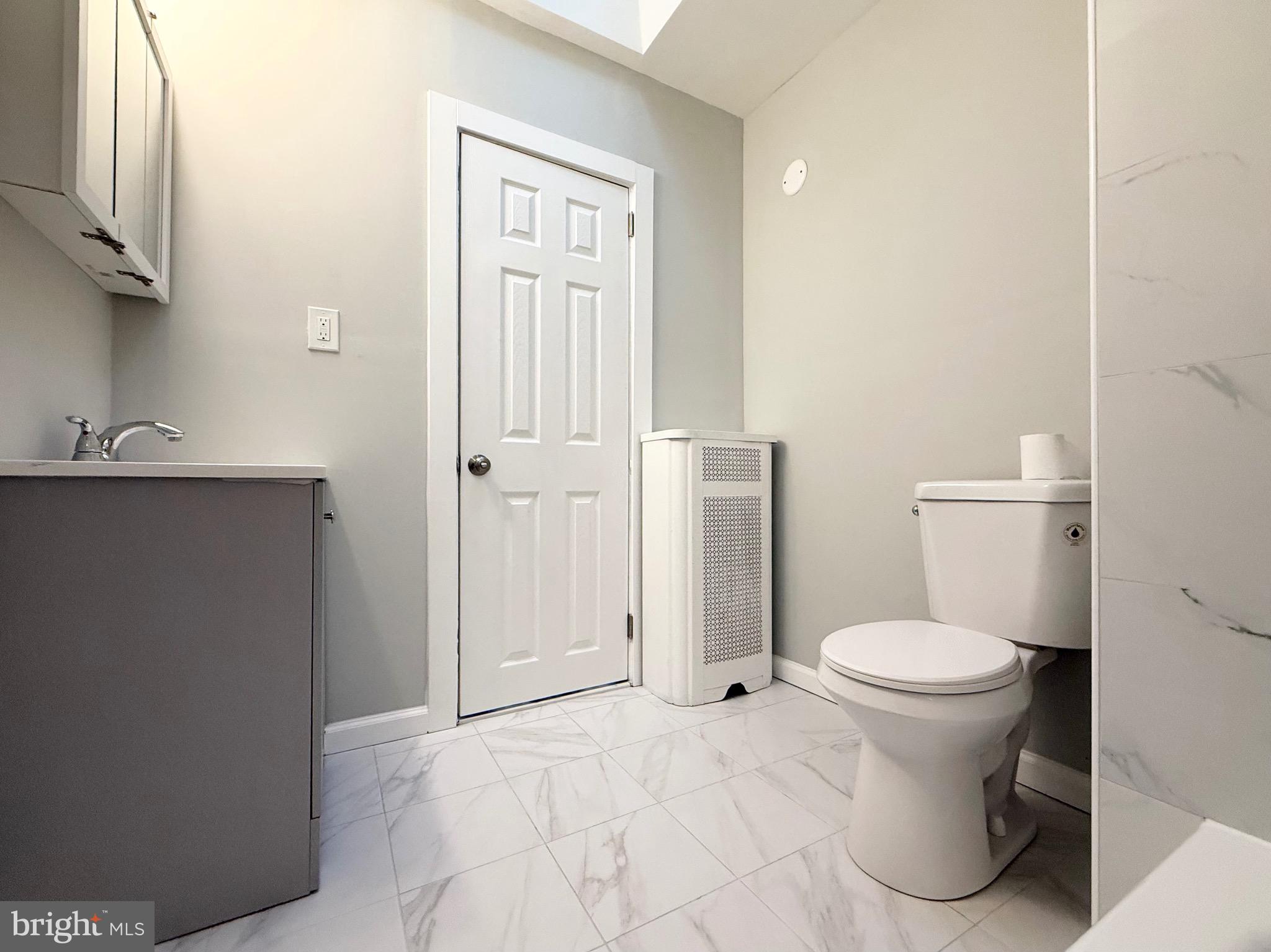 5842 North Hope Street Philadelphia, PA 19120 - Photo 31 of 45 a bathroom with a toilet and a sink