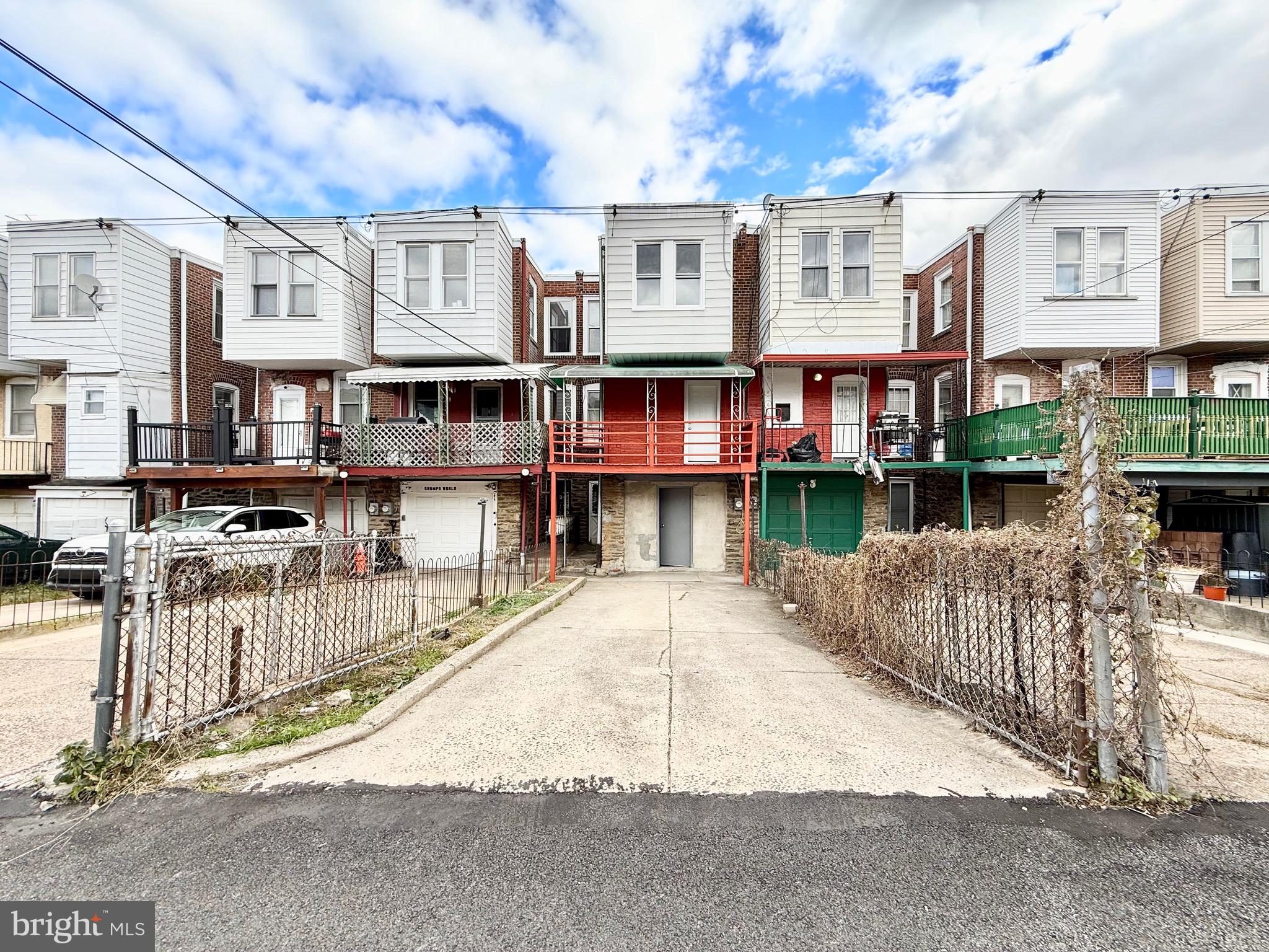 5842 North Hope Street Philadelphia, PA 19120 - Photo 43 of 45 a street view with tall buildings and a street