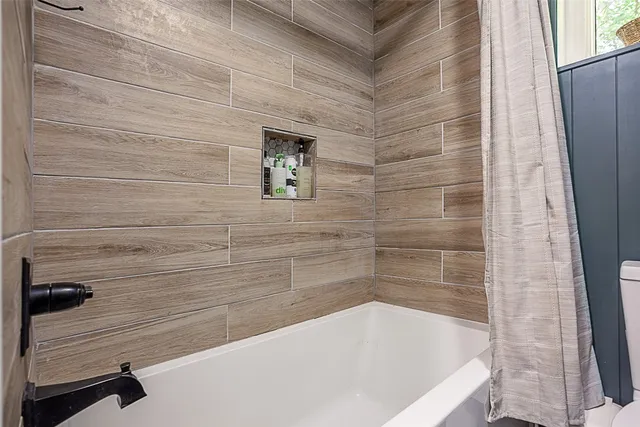 a bathroom with a bathtub