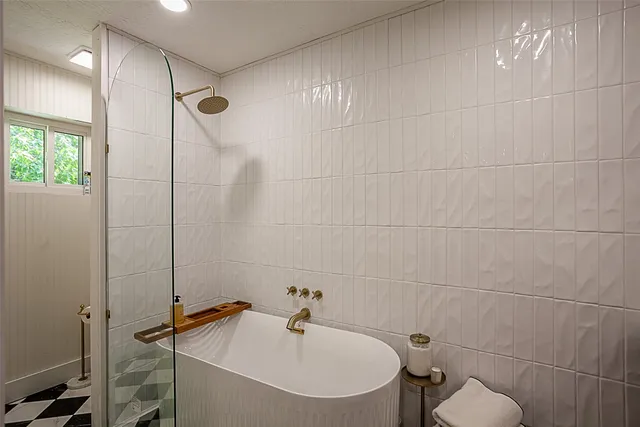a bathroom with a sink and a shower