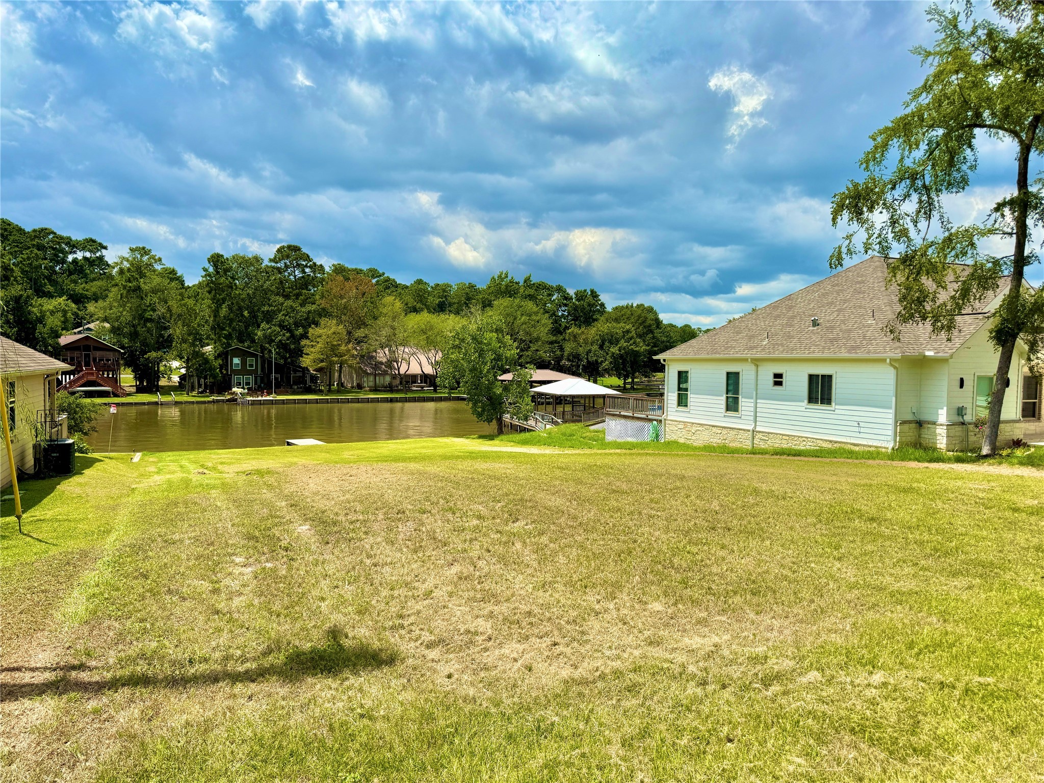 299 Twin Magnolia Onalaska, TX 77360 - Photo 2 of 3 a view of a swimming pool with an outdoor space and seating area