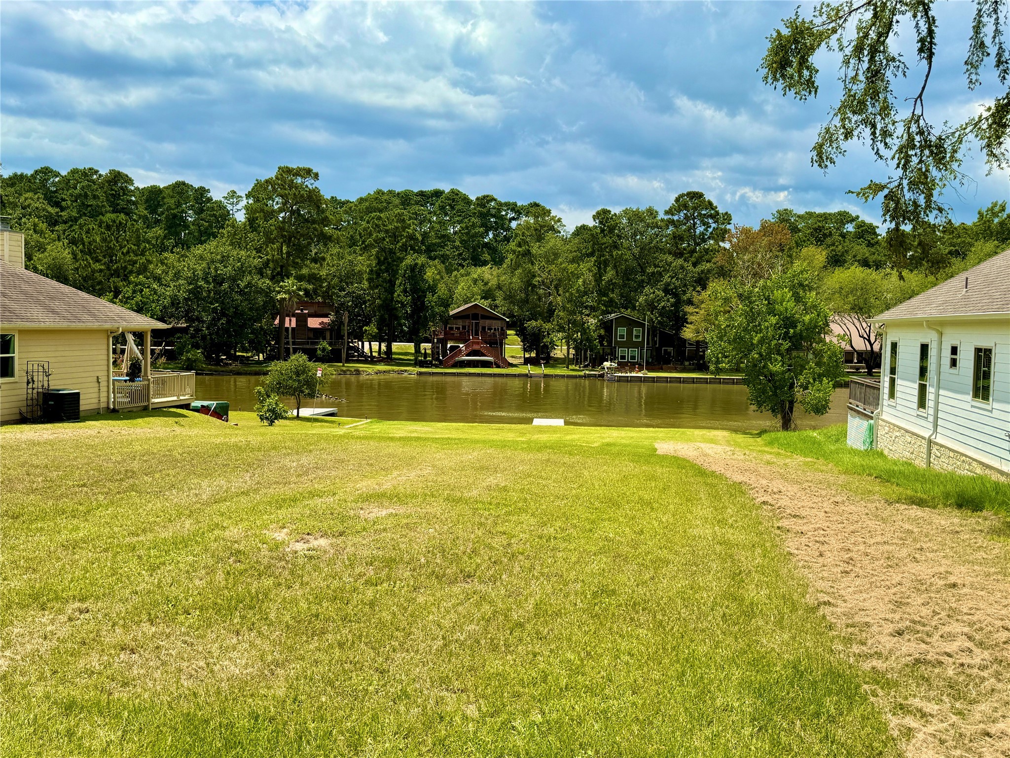 299 Twin Magnolia Onalaska, TX 77360 - Photo 3 of 3 a view of an house with swimming pool and a yard