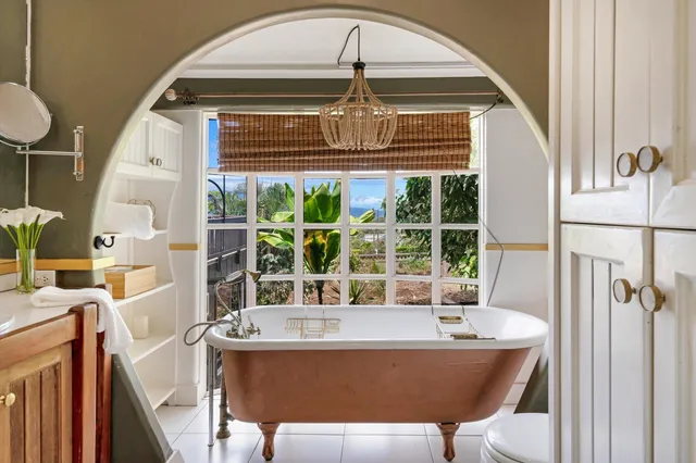 a view of a dining room with a table and chairs