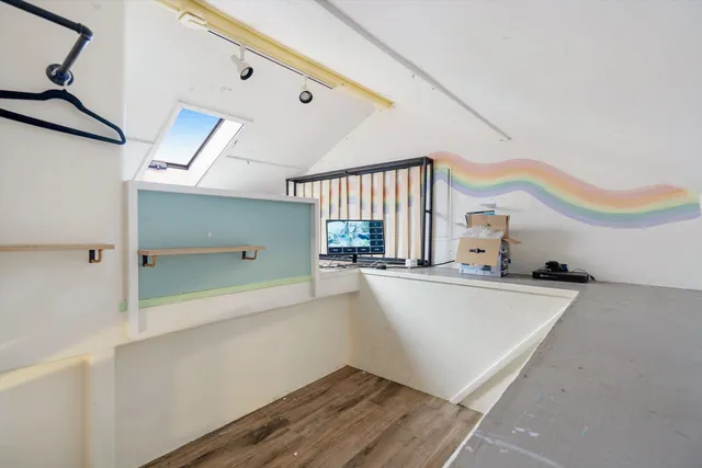 a view of a kitchen with a sink and cabinets