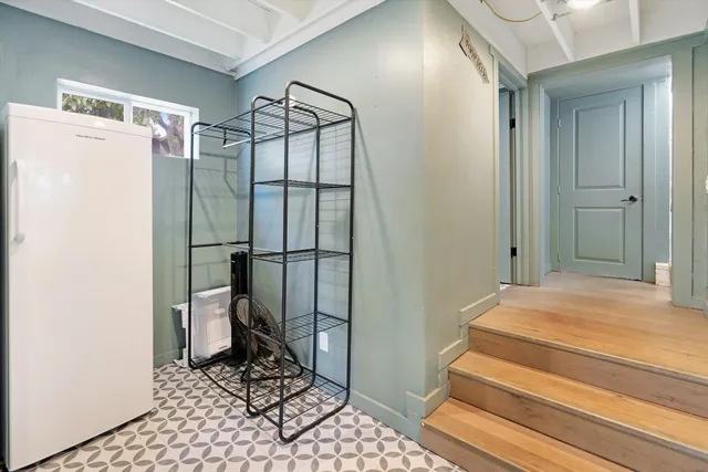 a bathroom with a sink and a glass door shower