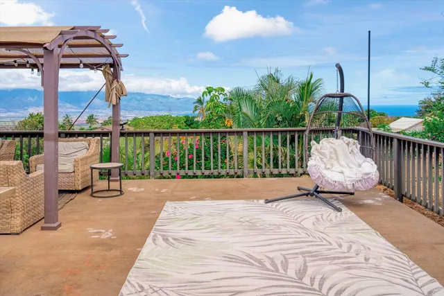 a view of balcony with furniture