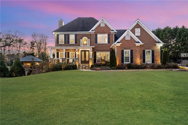 a swimming pool with outdoor seating and yard