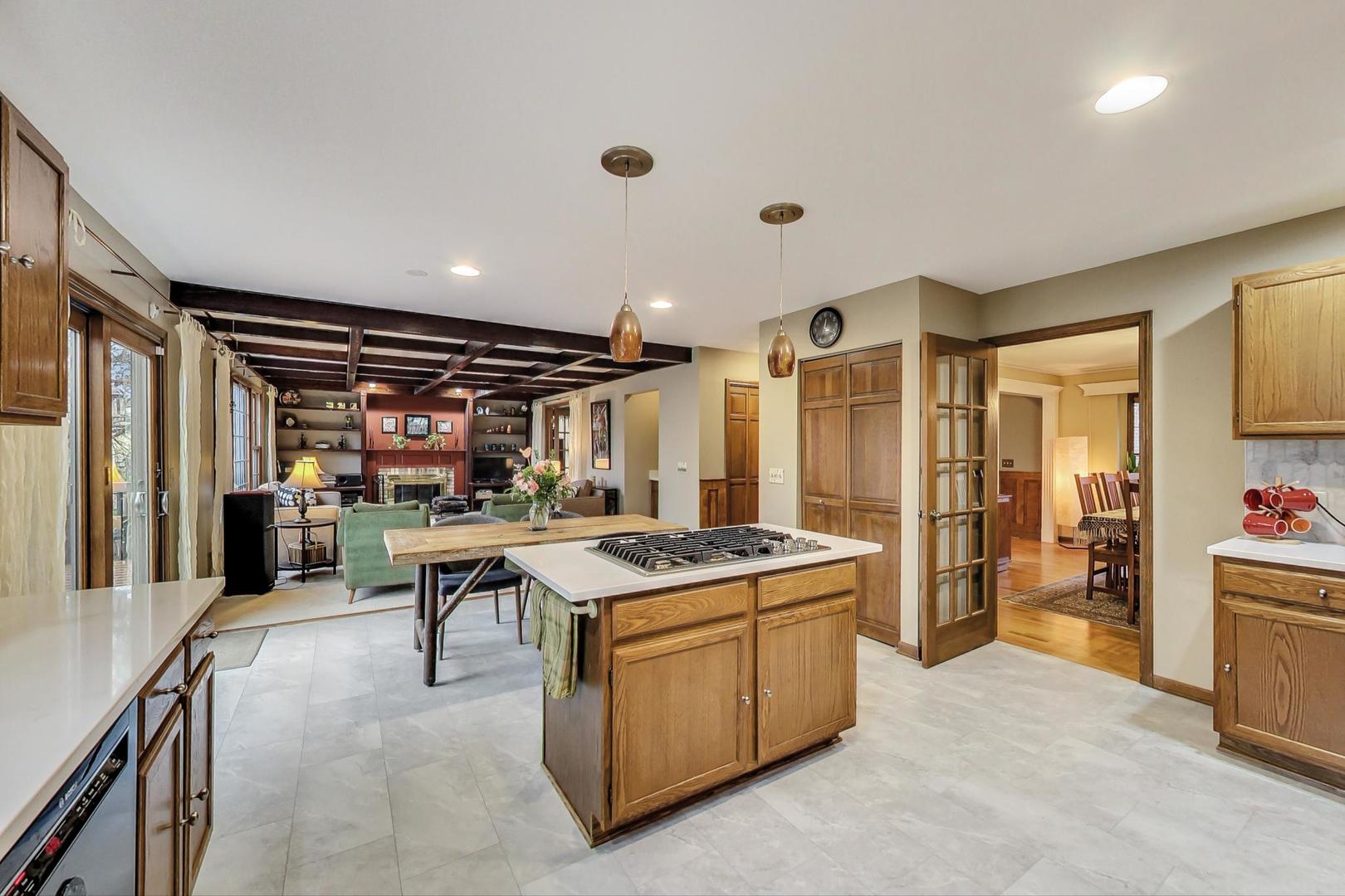 2185 Maplewood Drive Gurnee, IL 60031 - Photo 14 of 65 a kitchen that has a lot of cabinets a sink and a refrigerator