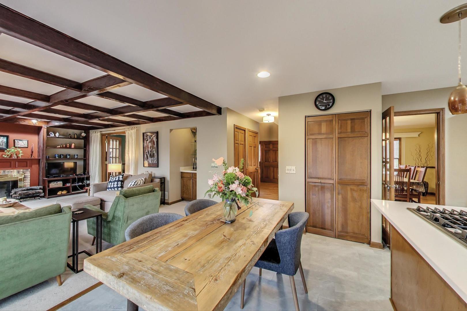 2185 Maplewood Drive Gurnee, IL 60031 - Photo 17 of 65 a view of a dining table and chairs in a kitchen