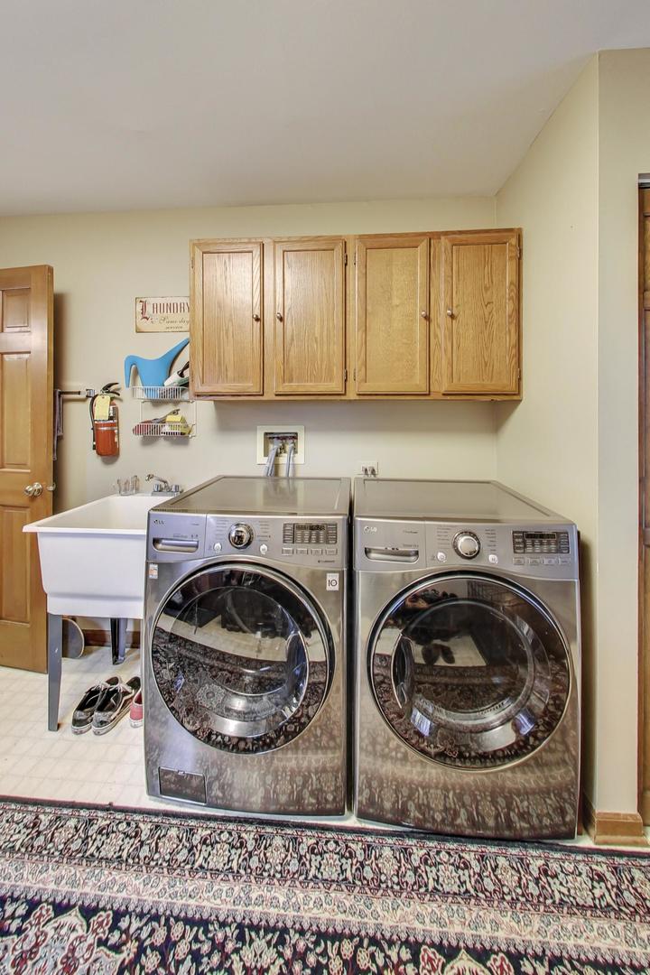 2185 Maplewood Drive Gurnee, IL 60031 - Photo 22 of 65 a kitchen with a sink a stove and cabinets