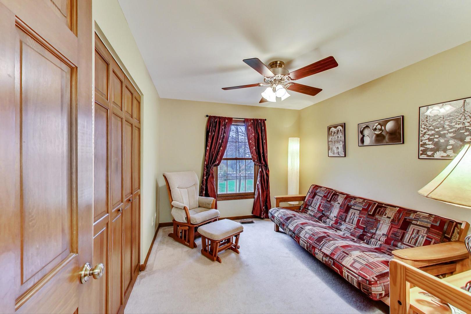 2185 Maplewood Drive Gurnee, IL 60031 - Photo 33 of 65 a living room with furniture and a window