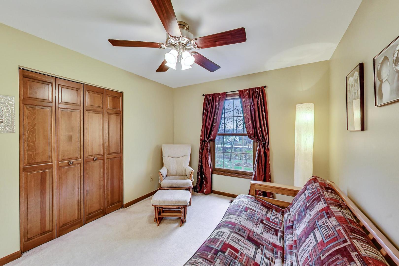 2185 Maplewood Drive Gurnee, IL 60031 - Photo 34 of 65 a living room with furniture and a window