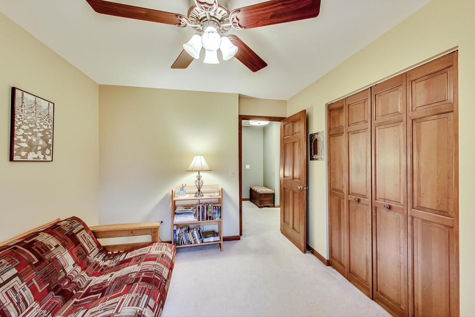 2185 Maplewood Drive Gurnee, IL 60031 - Photo 35 of 65 a bedroom with furniture and a chandelier